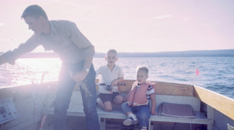 father taking sons on a boat trip