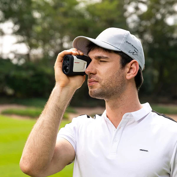A male golfer uses the MILESEEY PF210 rangefinder to measure distance.