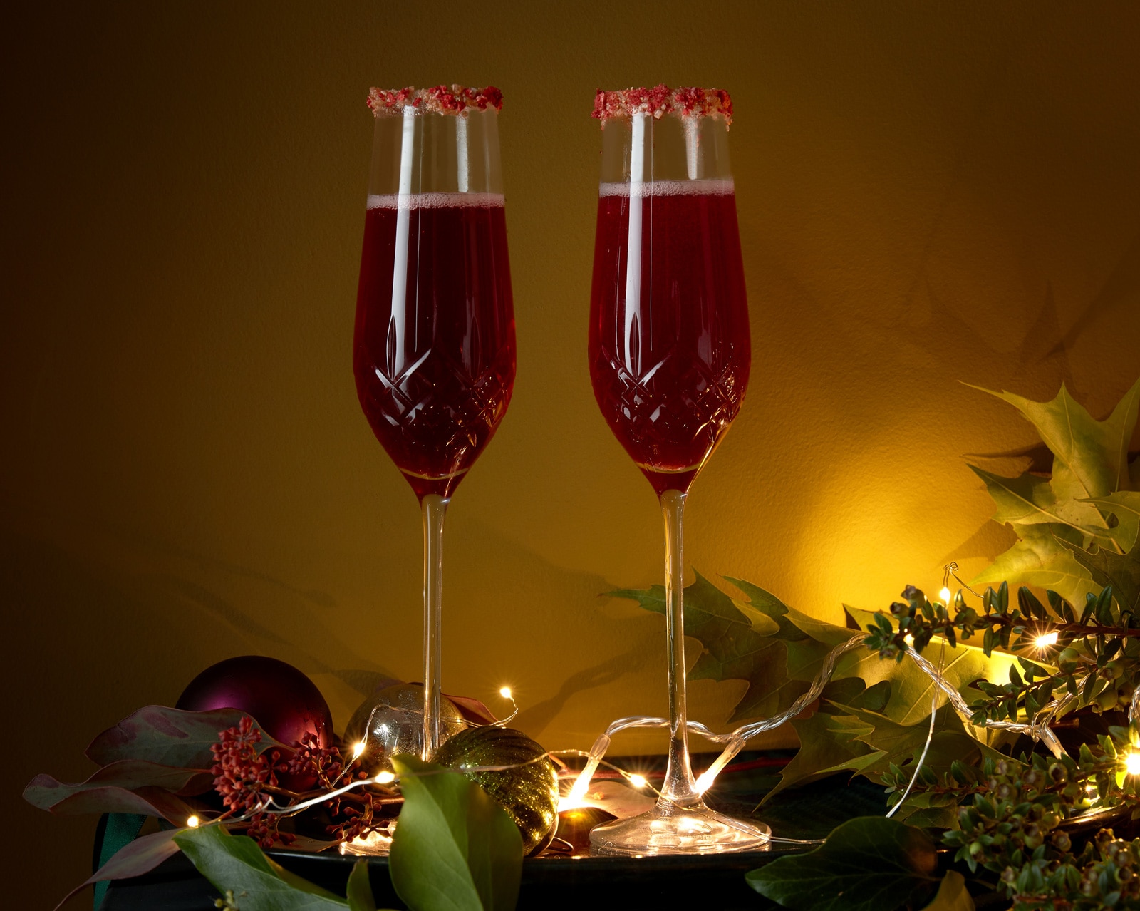 Champagne cocktails with dried raspberry rims