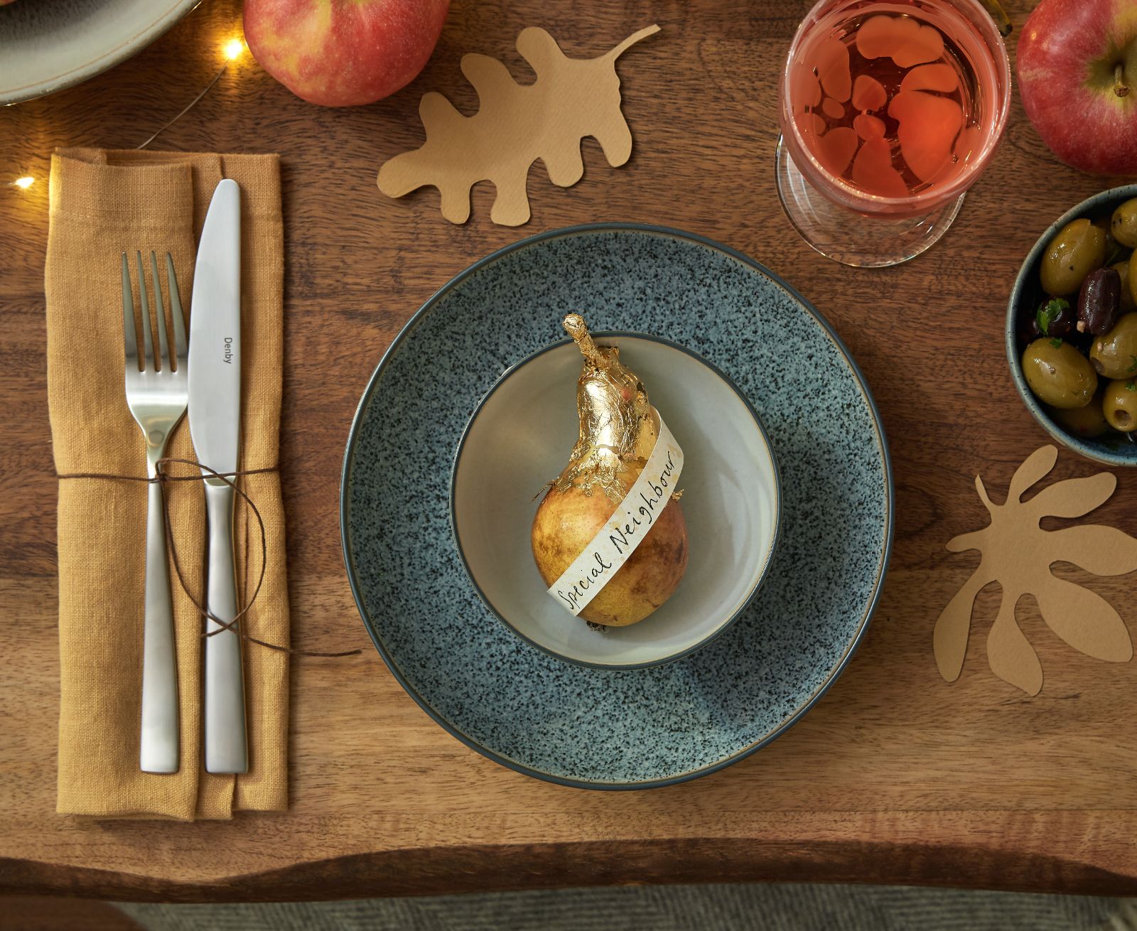 Thanksgiving place setting with name card around a