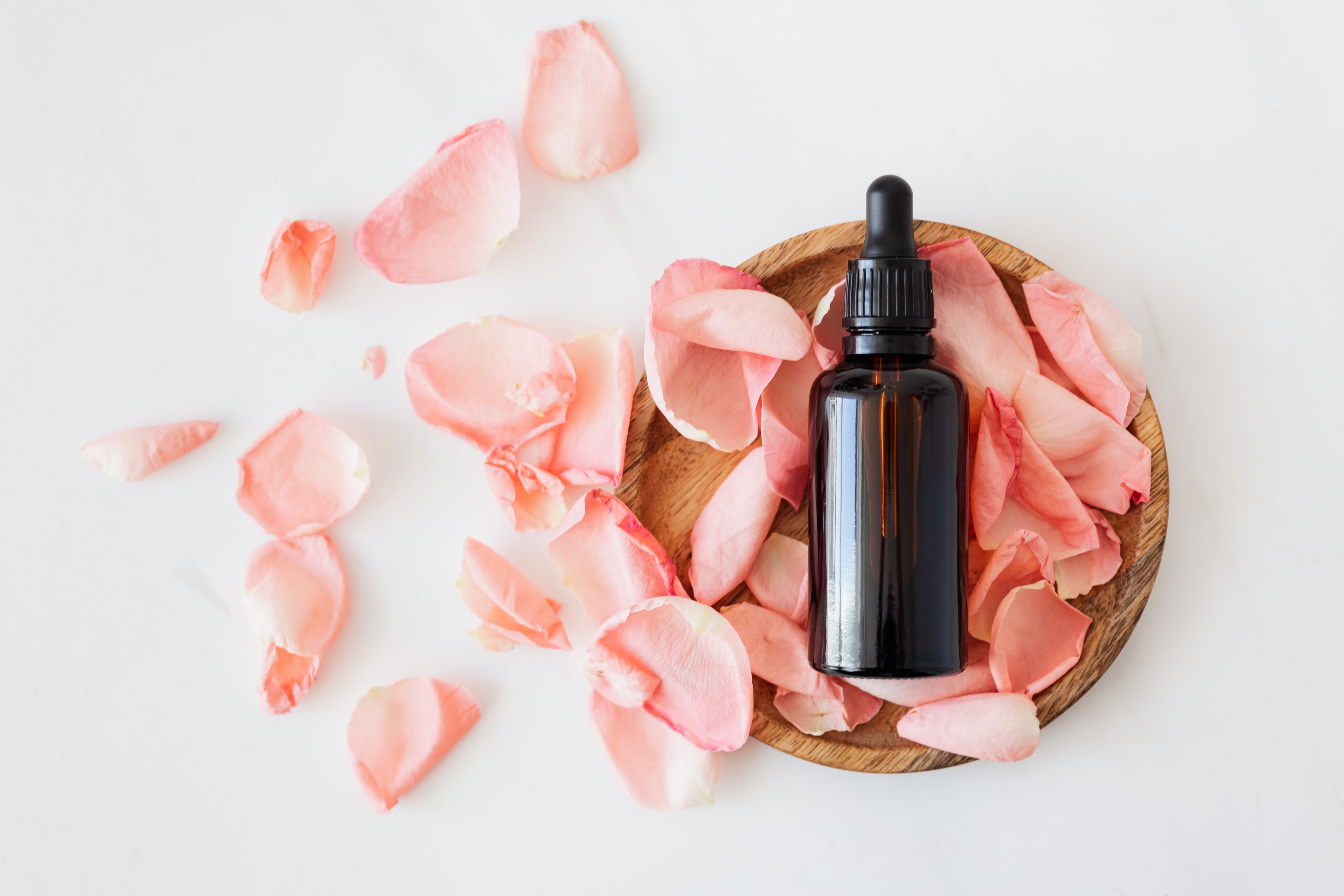 Essential oil and rose petals Essential oil and rose petals