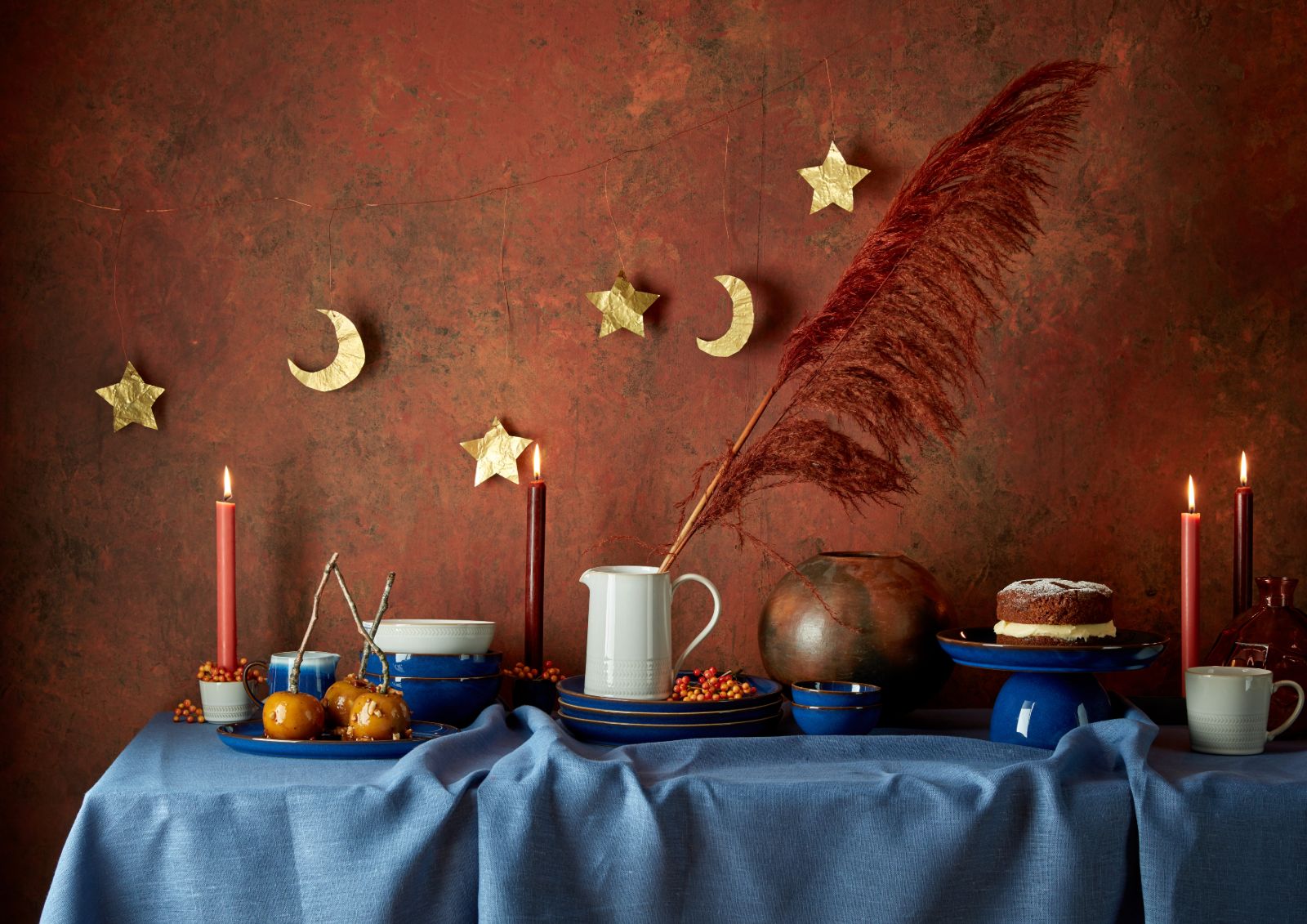Fall tableware with a large feather and gold moon 