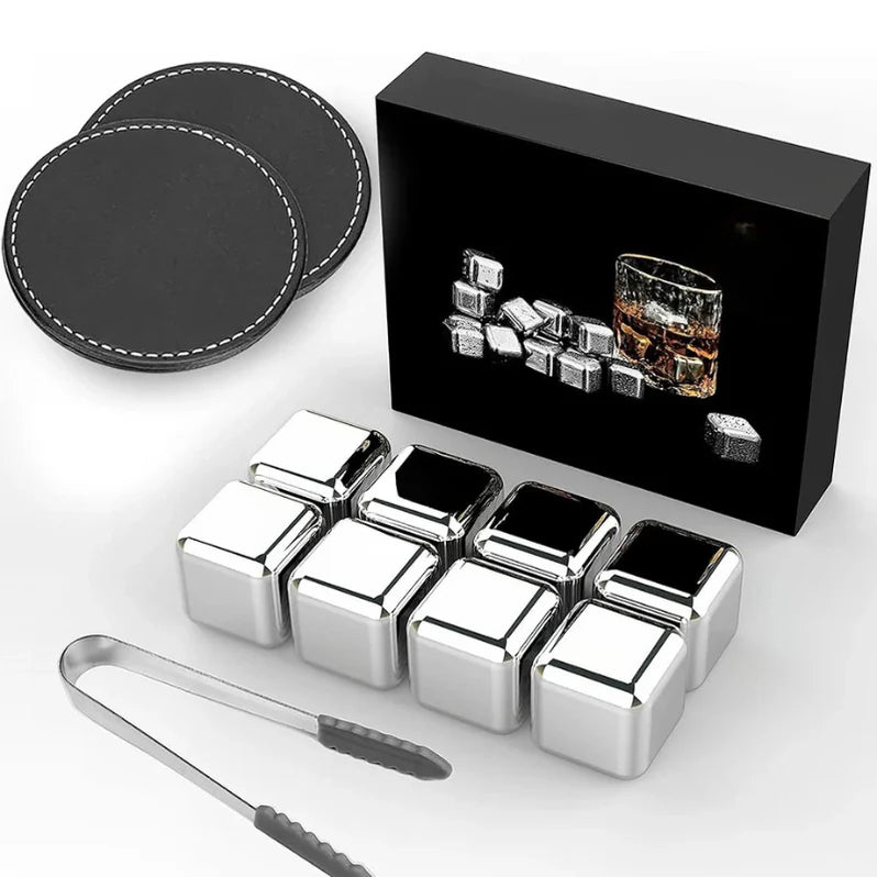 Set of reusable stainless steel whiskey stones with tongs and leather coasters, presented in a black gift box featuring a whiskey glass and stones image.