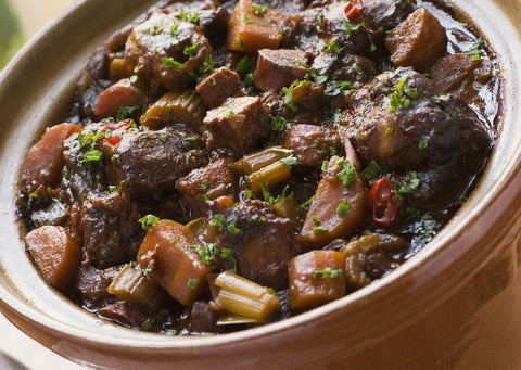 Oxtail stew with potatoes and spices and vegetables