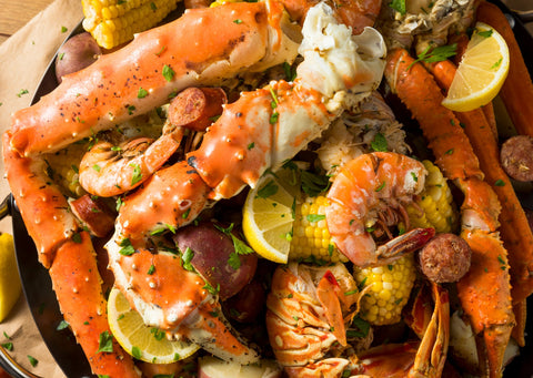 seafood boil, with crab, shrimp, sausage, corn and potatoes