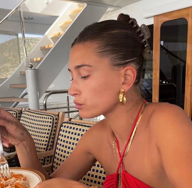 Woman with medium straight hair in sleek twist bun using jumbo tortoiseshell clip